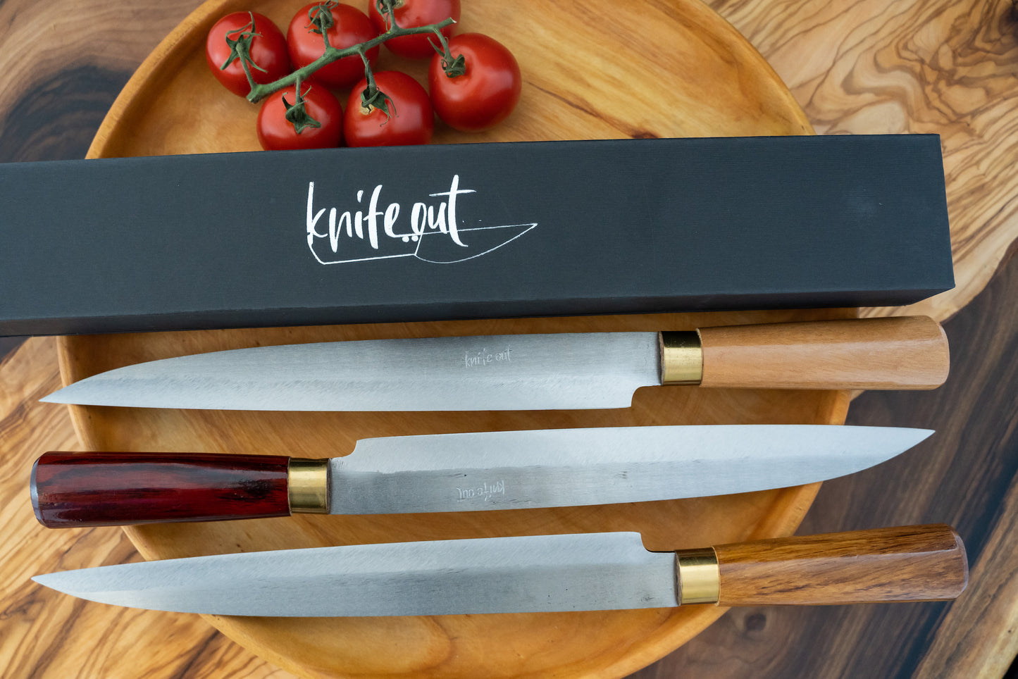 Kikubari japanese style carbon steel knife set in red, brown and light wood