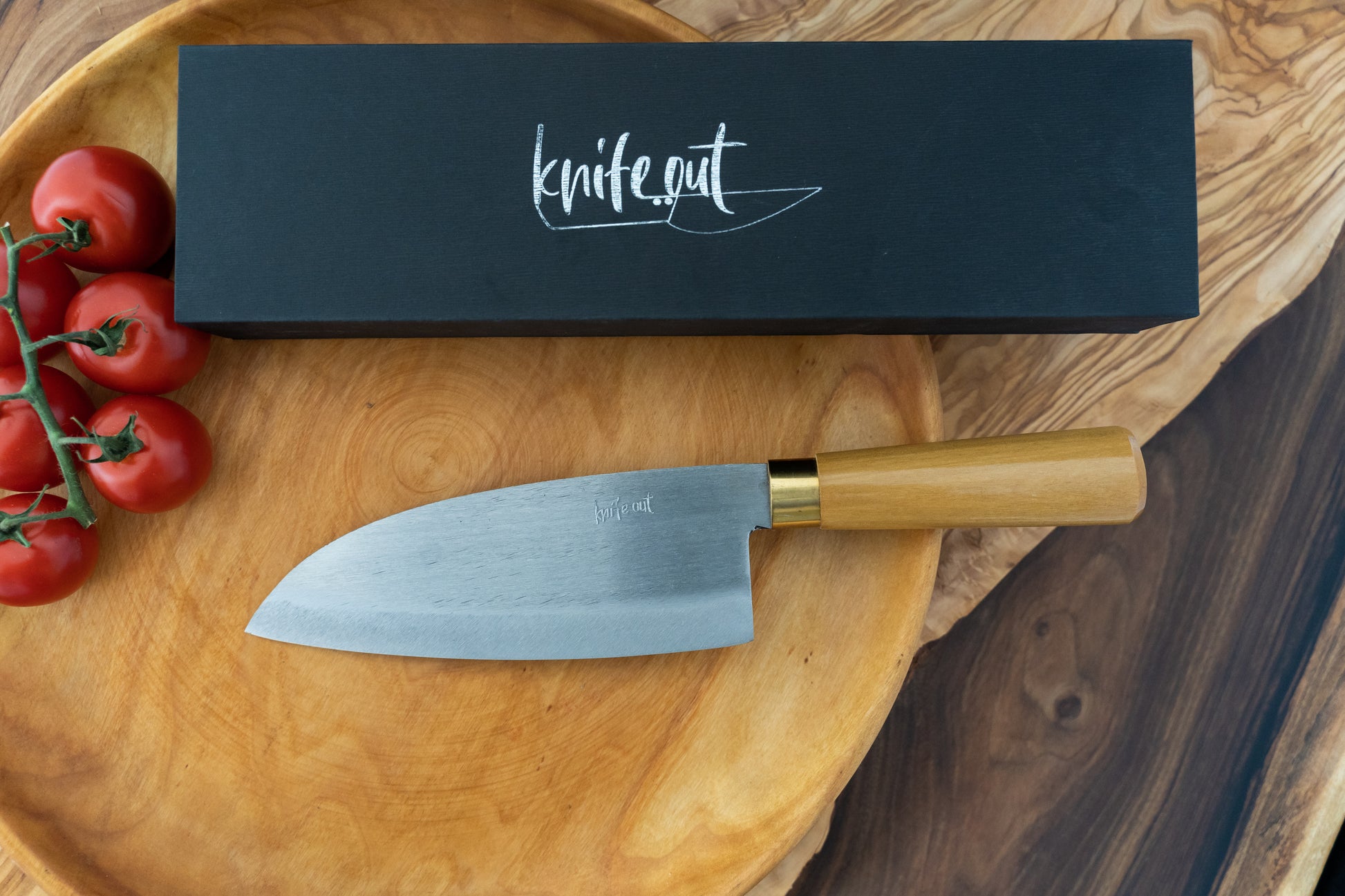 Chikara japanese carbon steel kitchen knife in light